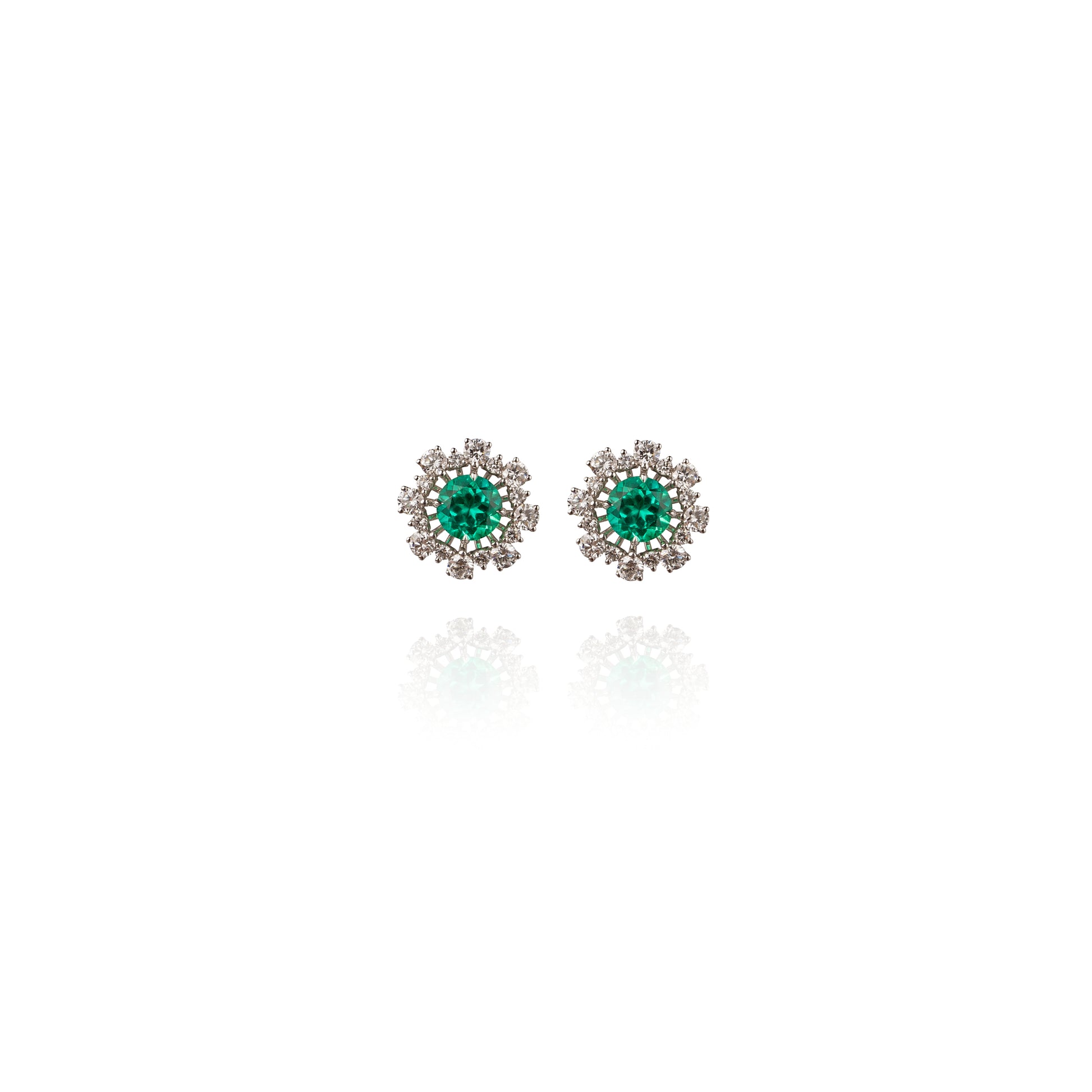 Emerald studs with diamond jacket